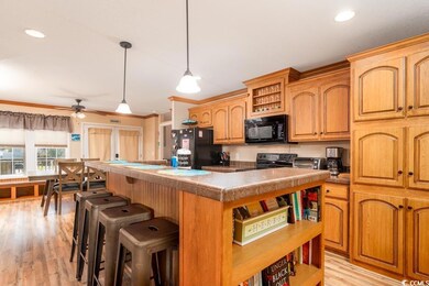Kitchen with light hardwood / wood-style flooring,
