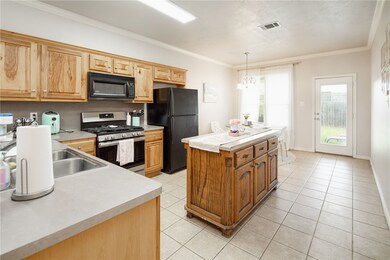 Kitchen featuring light tile patterned floors, bla