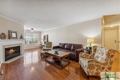 Living room with hard wood floors and cozy firepla