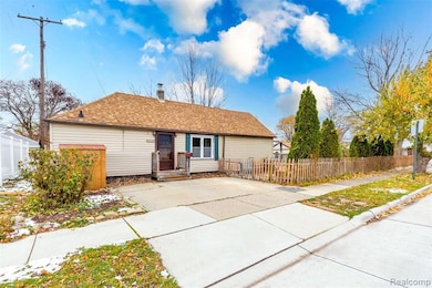 View of front of house featuring a chimney and a shingled roof