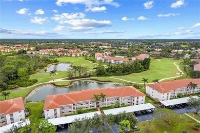 Birds eye view of property featuring golf course view and a water view
