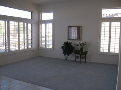 Front formal living room with shutters