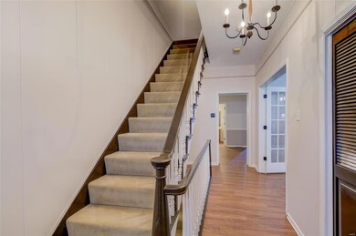 Entryway with stairs headed upstairs and down