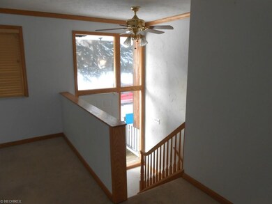 stairway, glass front and ceiling fan