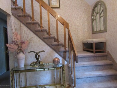 Staircase off of foyer