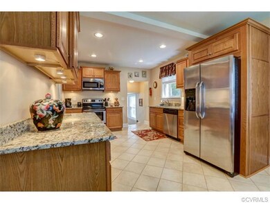 Renovated eat in kitchen with tile floor, granite 