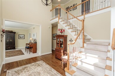 Dramatic 2-story foyer opens to formal living room