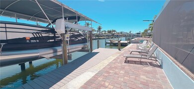 Dock area featuring a water view and boat lift