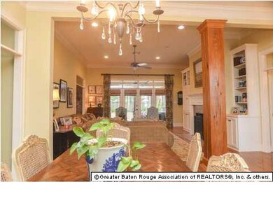 Formal dining flows to living to outdoor kitchen