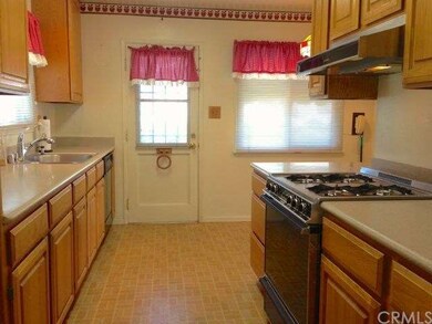 Kitchen has a side door to the driveway and garage