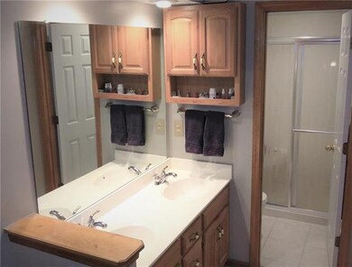 Master bath with double vanities and private showe