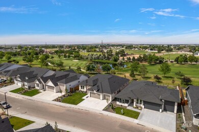 Aerial view of residential area with a golf club and a large body of water
