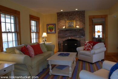 Comfortable Living Room with Wood Burning Brick Fireplace