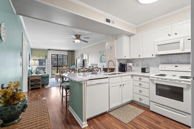 Kitchen featuring kitchen peninsula, ornamental mo