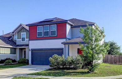 Traditional home with an attached garage, fence, 