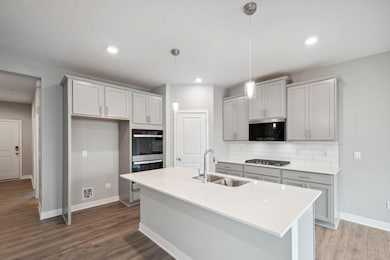 Photo of model home similar to new Henry plan, color & options will vary.