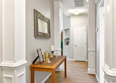 Foyer view into the home and of the coat closet