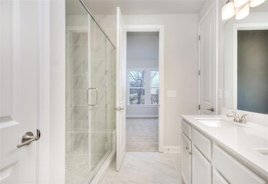 Bathroom featuring tile flooring, vanity with exte