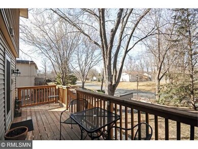 Nestled among single family homes this end unit en