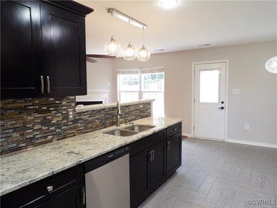 Kitchen featuring tasteful backsplash, sink, decor