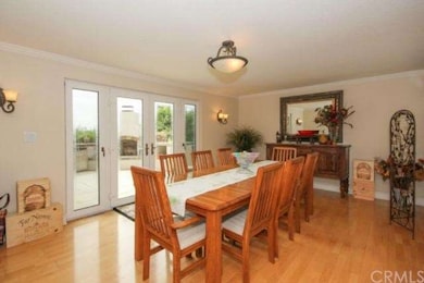 Dining room has hardwood flooring with French door