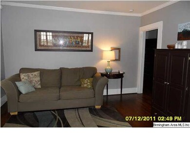 Great room with hardwoods and a fireplace.