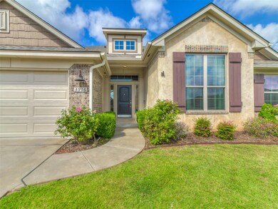 View of front of property featuring a garage and a