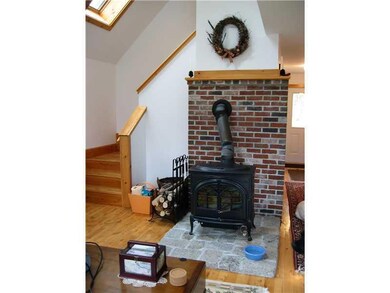 Living Room. Woodstove on granite...
