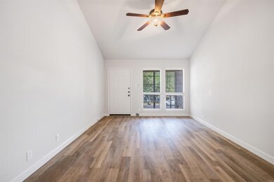 Spare room with baseboards, ceiling fan, wood fin