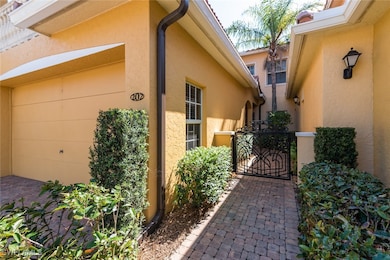 View of home's exterior with a gate and stucco siding