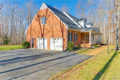 Large Paved Driveway with attached two-car garage