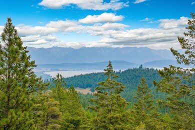 Panoramic vistas over the forested hills and sparkling Flathead Lake