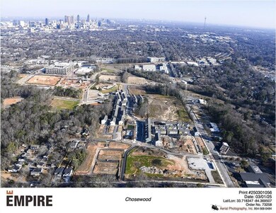 View of property location with nearby urban area