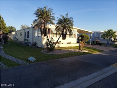 View of front of home featuring a front lawn and a