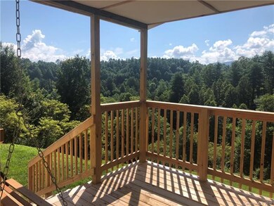 Covered front porch complete with porch swing and 