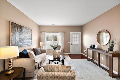 Living area featuring plenty of natural light and wood finished floors
