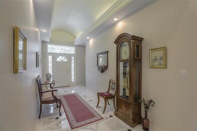 Beautiful marble flooring in entry with barrel vau