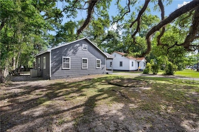 View of home's exterior featuring crawl space and cooling unit