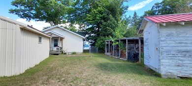 Backyard w/wood storage & Shed