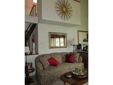 Living Room. Looking up at the loft area