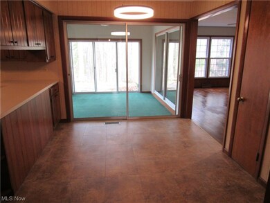 Corridor with wooden walls and light tile floors
