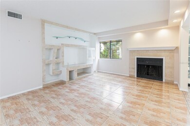 The living room is centered by a wood burning fire