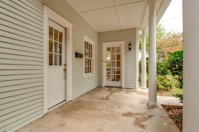Great covered front porch with privacy from the street
