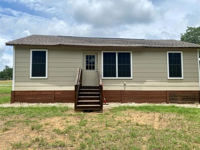 Rear view of house with entry steps