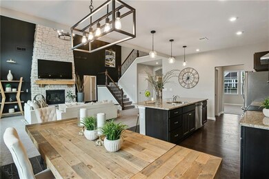 Dining space featuring dark wood-style flooring, v