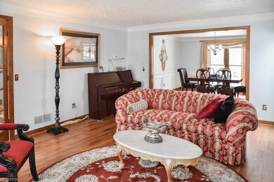 Formal living room with crown molding.