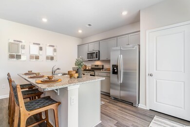 Kitchen with appliances with stainless steel finis
