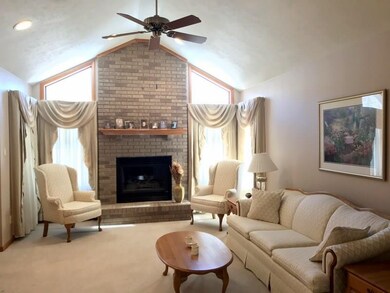 LIVING ROOM WITH VAULTED CEILING AND GAS FIREPLACE