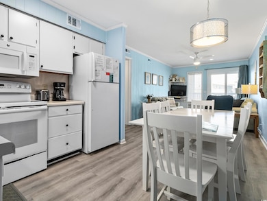 Dining space featuring light wood-style floors, vi