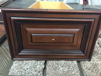 Cherry Mocha cabinets with bronze hardware in kitchen & bathrooms.